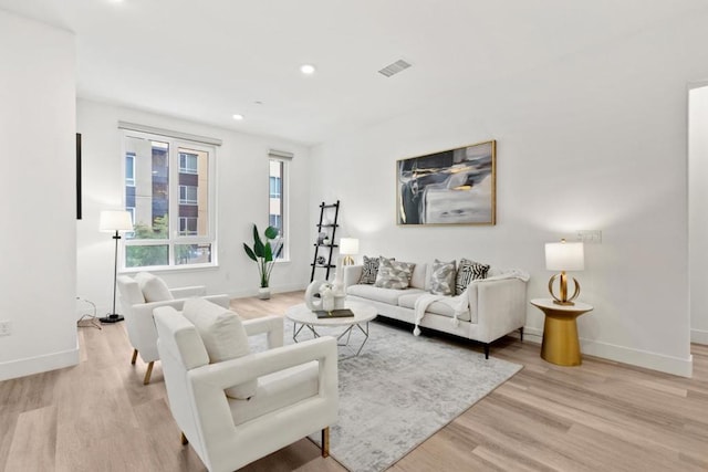 living room with light hardwood / wood-style floors