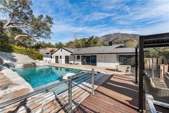 view of pool featuring a fenced in pool, a mountain view, and a patio