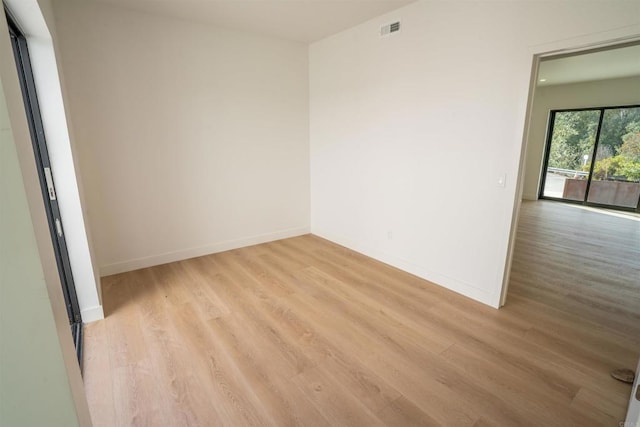 unfurnished room featuring light hardwood / wood-style flooring