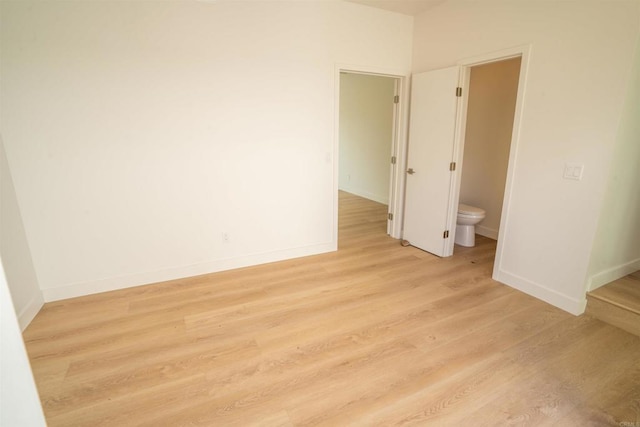 spare room featuring light hardwood / wood-style floors