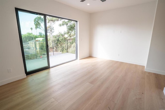 unfurnished room featuring light hardwood / wood-style flooring and ceiling fan