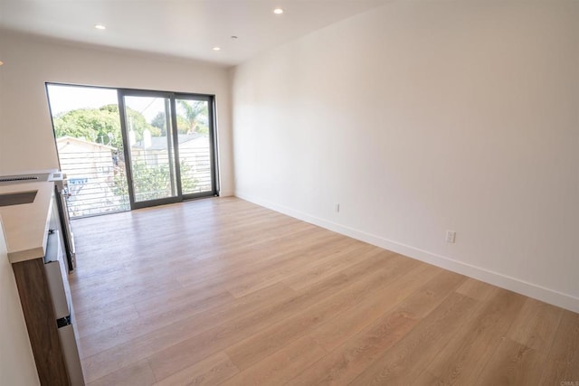 unfurnished living room featuring light hardwood / wood-style floors