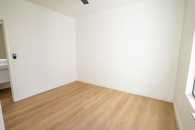 spare room featuring ceiling fan and light hardwood / wood-style floors