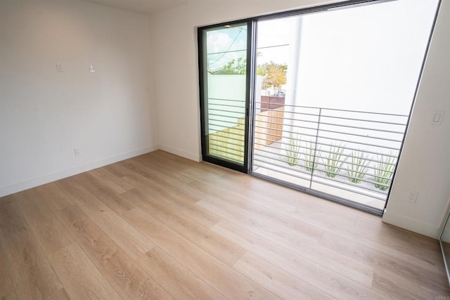 unfurnished room featuring light wood-type flooring