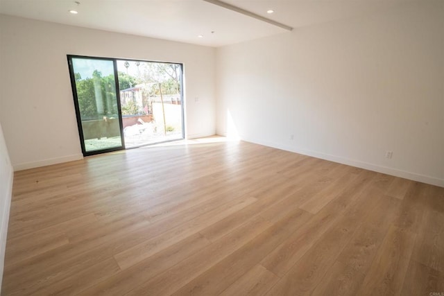 spare room featuring light hardwood / wood-style floors