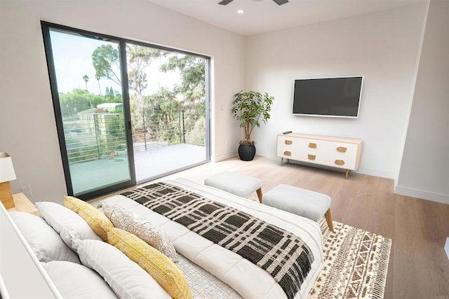 living room featuring ceiling fan and light wood-type flooring