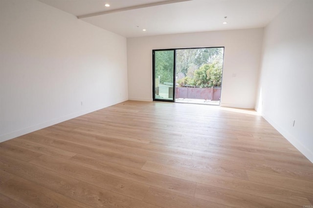 unfurnished room featuring light hardwood / wood-style floors