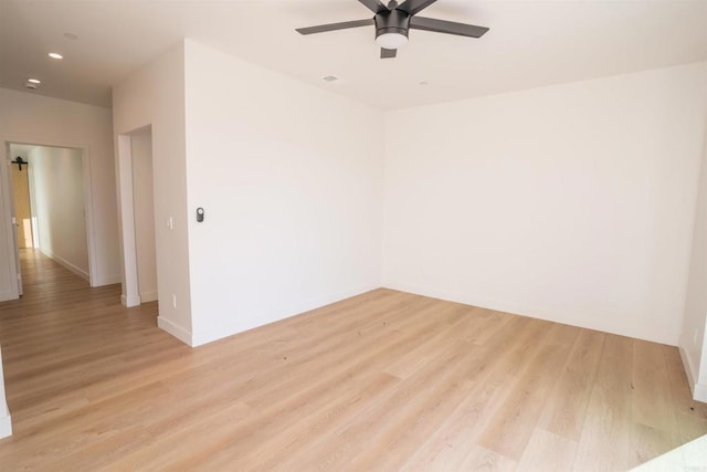 spare room with ceiling fan and light hardwood / wood-style floors