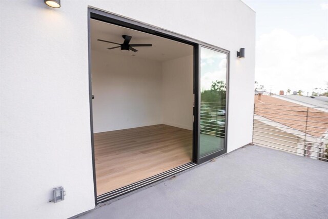 exterior space with ceiling fan