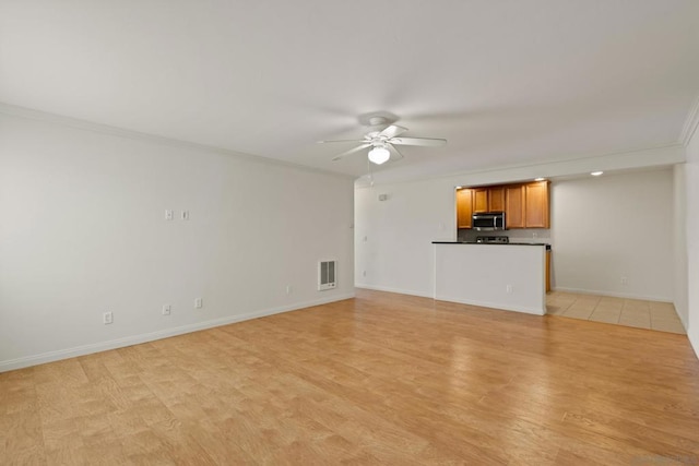 unfurnished living room with ornamental molding, ceiling fan, and light hardwood / wood-style floors