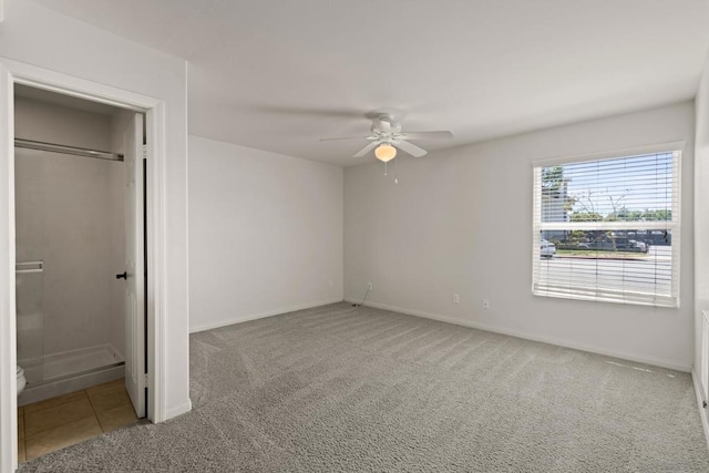 unfurnished bedroom featuring carpet and ceiling fan