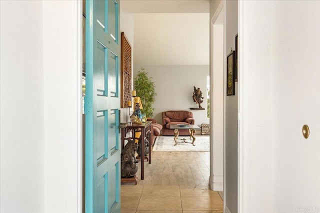 corridor featuring light tile patterned floors