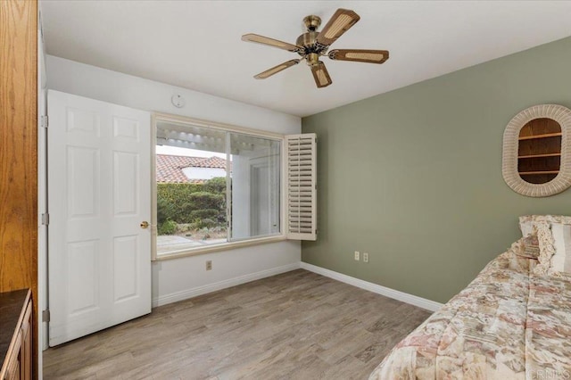 unfurnished bedroom featuring ceiling fan and light hardwood / wood-style flooring