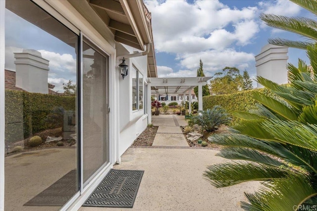 exterior space with a patio and a pergola