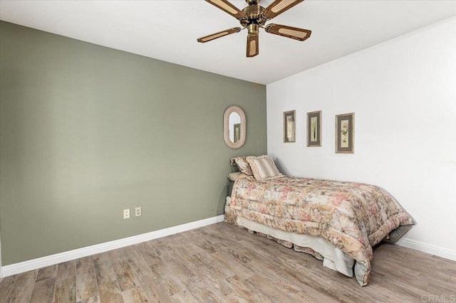 bedroom featuring ceiling fan and light hardwood / wood-style flooring