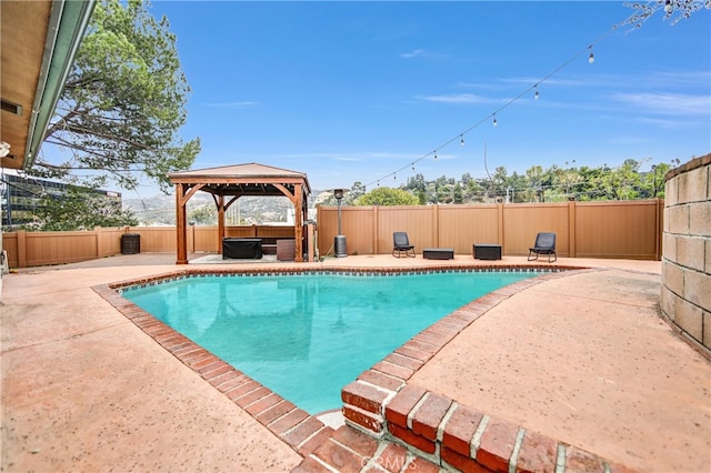 view of pool with a fenced in pool, a gazebo, a patio, and a fenced backyard