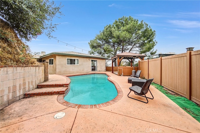 view of swimming pool with a fenced in pool, a gazebo, a patio area, and a fenced backyard