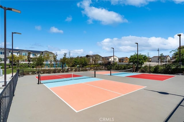 view of sport court featuring basketball hoop