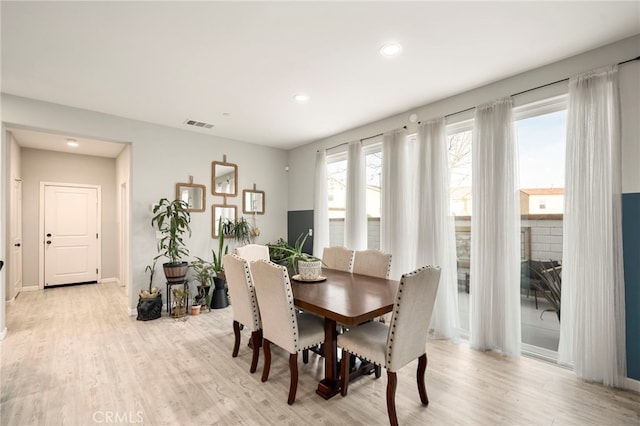 dining area with light wood-type flooring