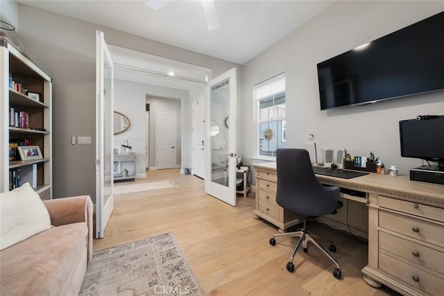 home office featuring light hardwood / wood-style flooring and french doors