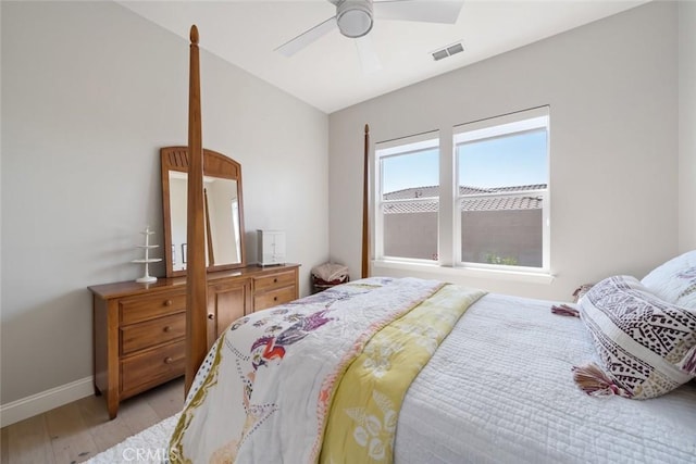 bedroom with ceiling fan and light hardwood / wood-style flooring