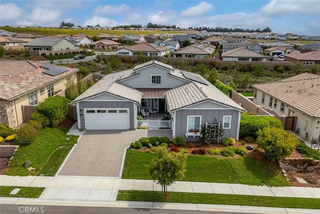 view of front of property featuring a garage and a front yard