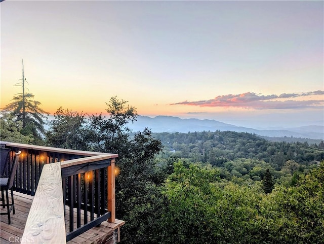 view of mountain feature featuring a forest view