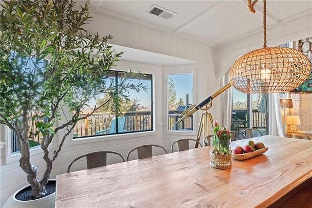 dining space with a chandelier and visible vents