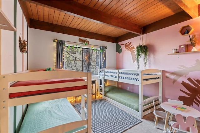 carpeted bedroom featuring wooden ceiling and beam ceiling