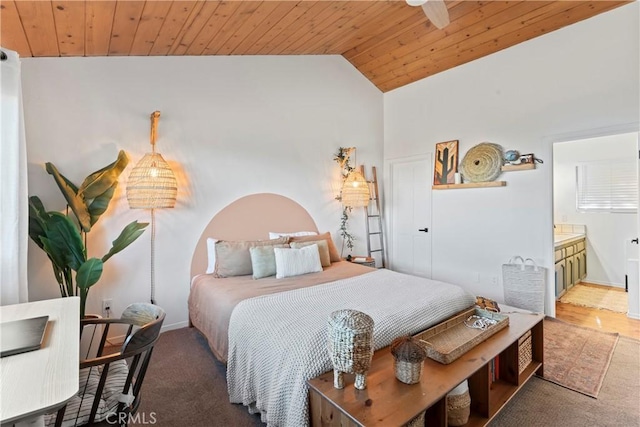 bedroom with carpet floors, ensuite bathroom, vaulted ceiling, wooden ceiling, and baseboards