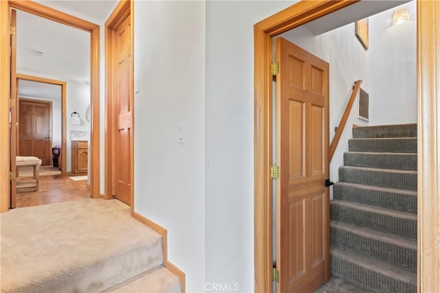 stairs featuring carpet flooring and visible vents