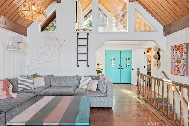 living area with wood ceiling, high vaulted ceiling, wood finished floors, and beamed ceiling