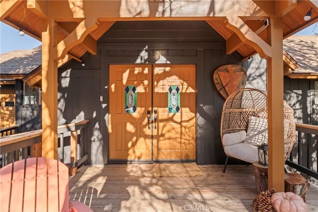 exterior space featuring roof with shingles