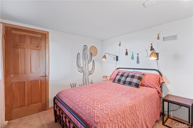 bedroom with carpet floors and visible vents