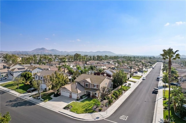 birds eye view of property with a mountain view