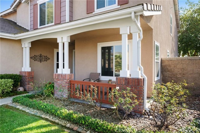 doorway to property with covered porch