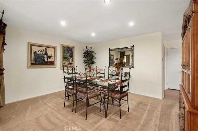 dining area with light carpet