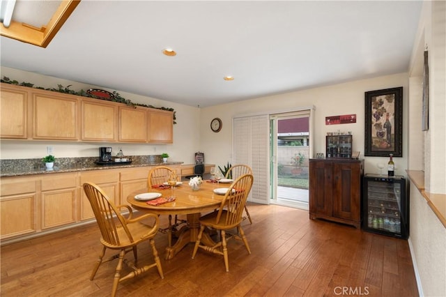 dining room featuring wine cooler and wood-type flooring