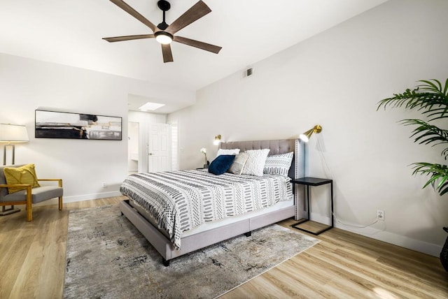 bedroom featuring ceiling fan and light hardwood / wood-style flooring