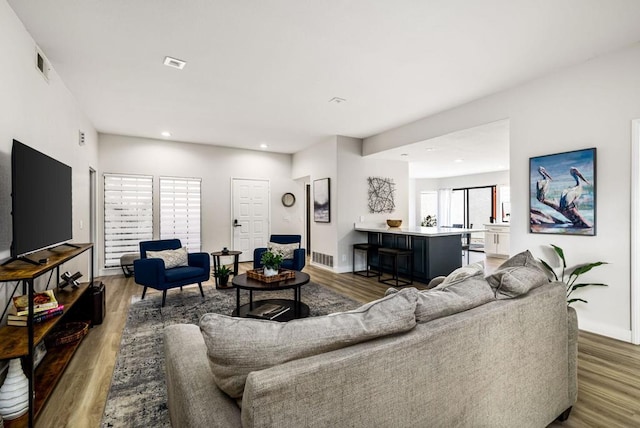 living room featuring dark hardwood / wood-style flooring