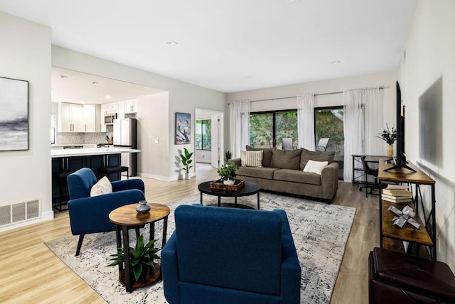 living room featuring light wood-type flooring