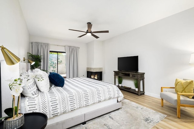 bedroom featuring hardwood / wood-style flooring and ceiling fan