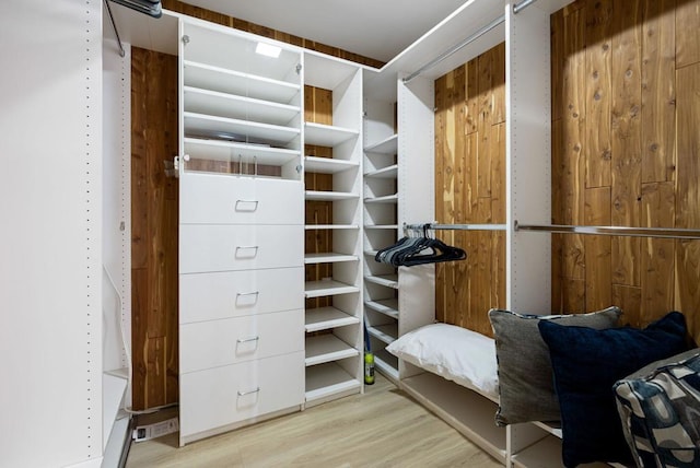 spacious closet featuring light wood-type flooring