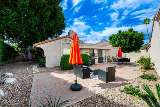 view of patio / terrace with an outdoor living space and area for grilling