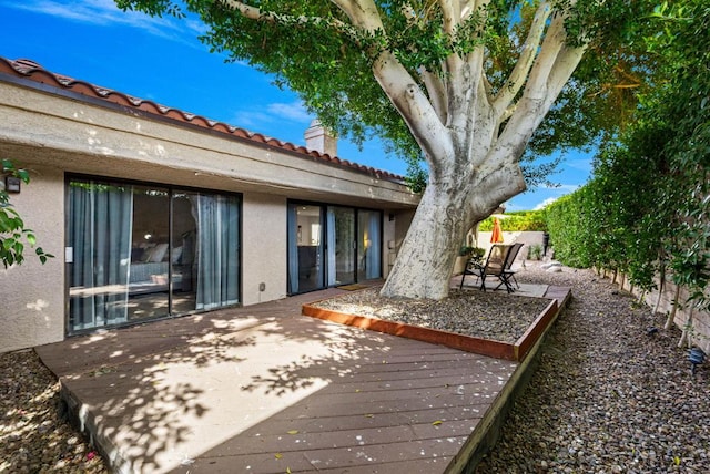 rear view of property with a deck