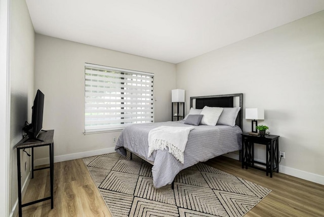 bedroom with wood-type flooring