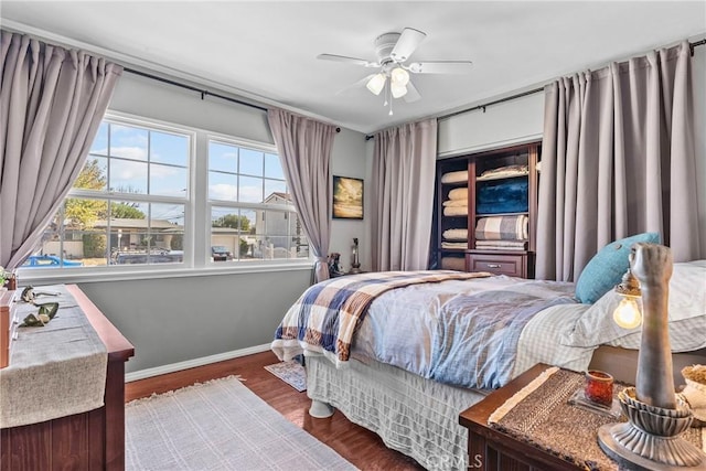 bedroom featuring dark wood-type flooring and ceiling fan