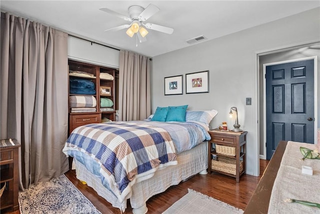 bedroom featuring dark wood-type flooring and ceiling fan