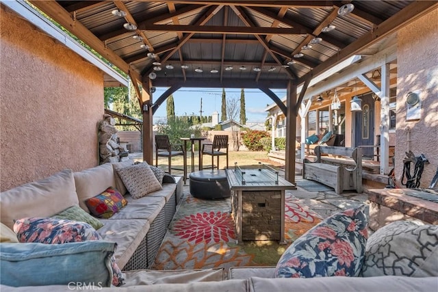 view of patio / terrace featuring an outdoor living space and a gazebo