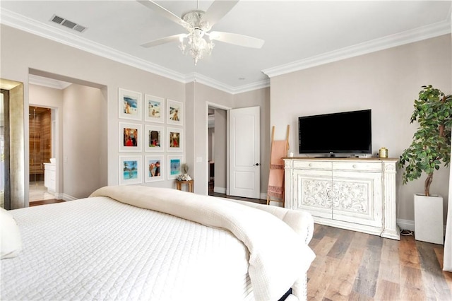 bedroom with ceiling fan, ornamental molding, and hardwood / wood-style floors